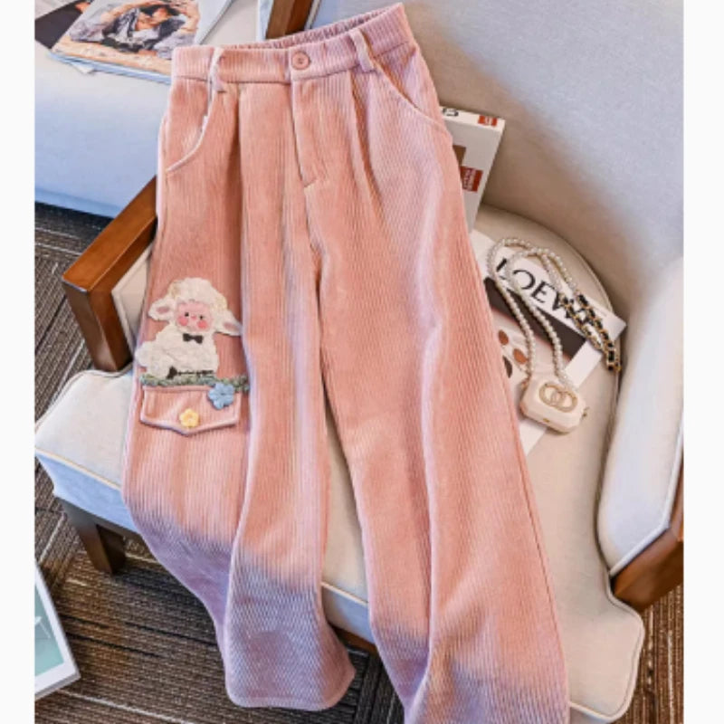 Pink plush sheep pants with dreamy fit and floral knee detail, designed for littlespace, ABDL, and kawaii girls