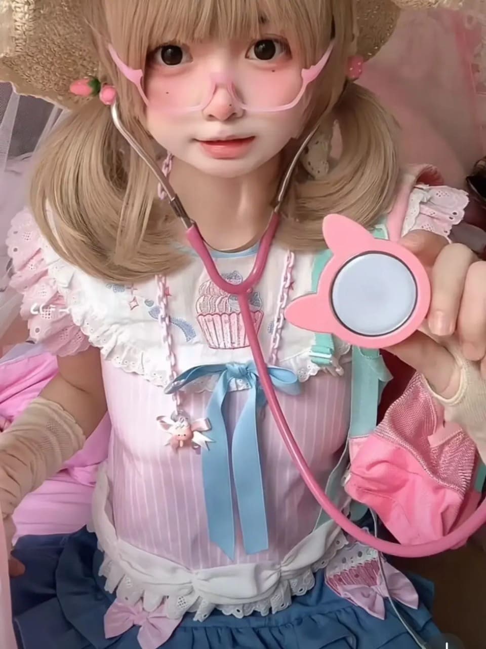 Babydoll tee with soft pastel hues, ruffle shoulders, and delicate bow detail
