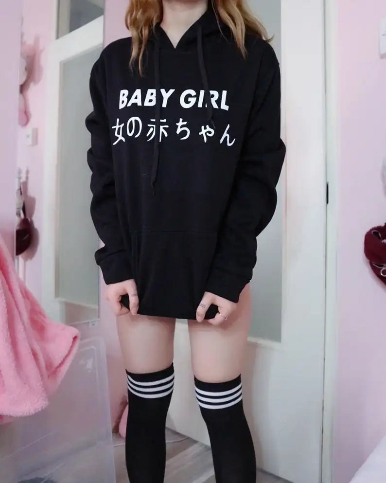 Black Babygirl Tokyo Street Hoodie with Japanese print, styled on model for urban streetwear look.