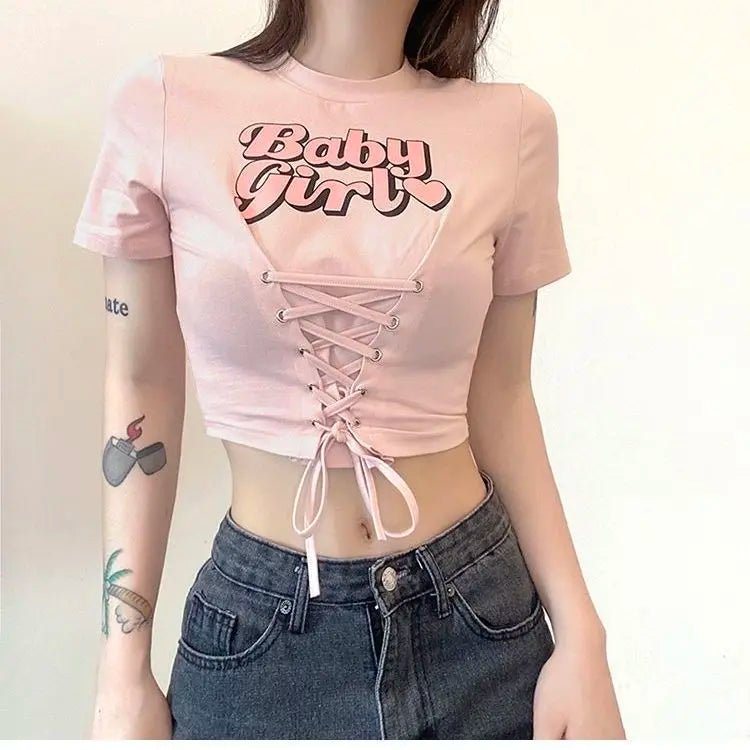 Babygirl Glow lace-up crop top in pastel pink, perfect for soft girl and baddiecore styles