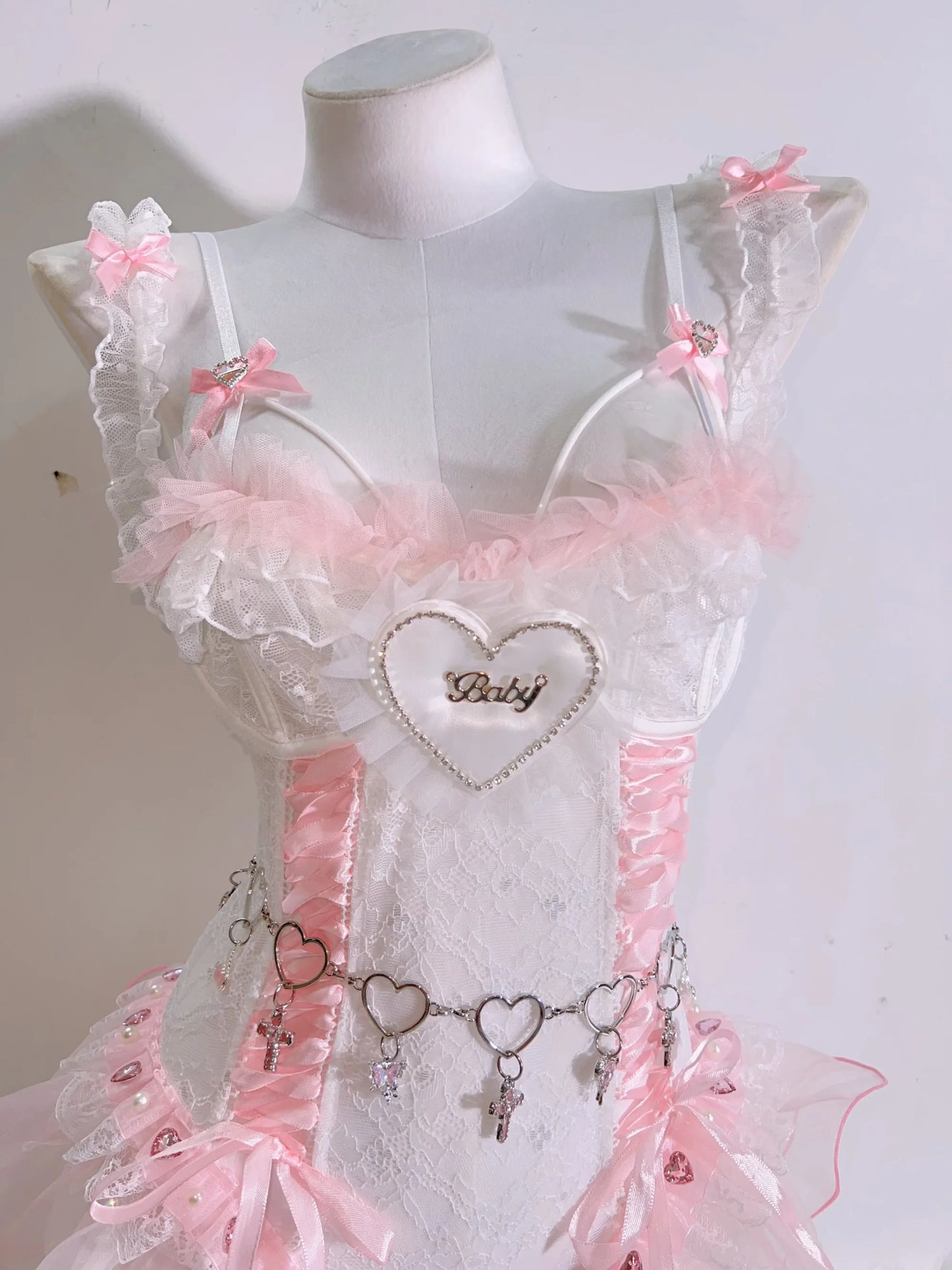 Soft girl ballerina corset set ideal for DDLG and ABDL play, with light pink lace and satin and cute heart accents