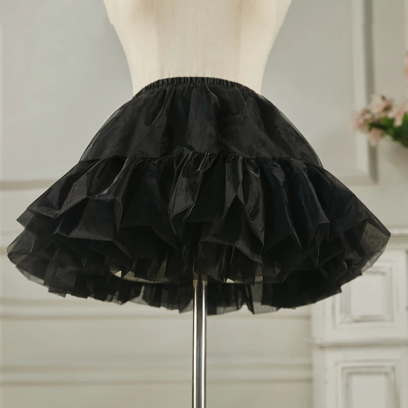 Black petticoat underskirt crinoline layer providing lightweight volume and structure