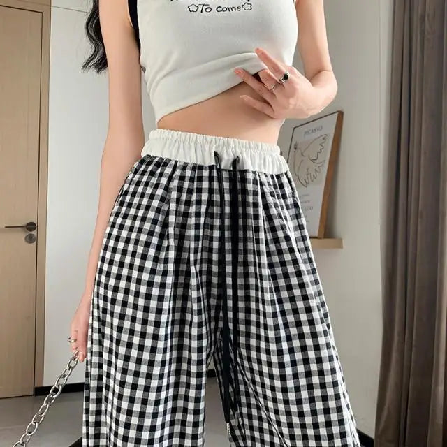 Black plaid dollycore pants with floor-length drop for comfy ddlg abdl outfits