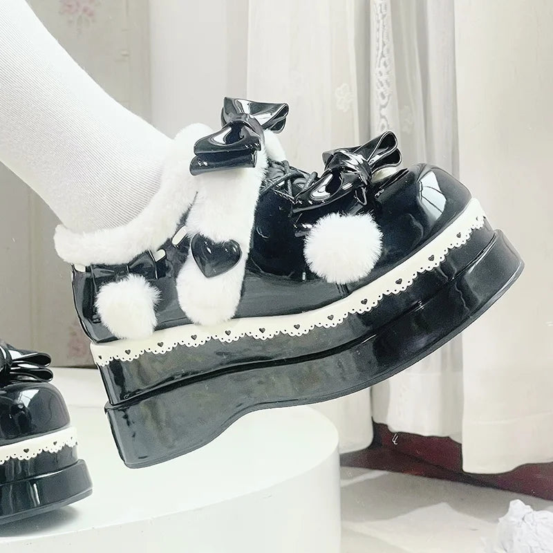 Black Pom Pom Angel Baby Platform Shoes featuring fluffy pom poms and heart details for kawaii princess looks