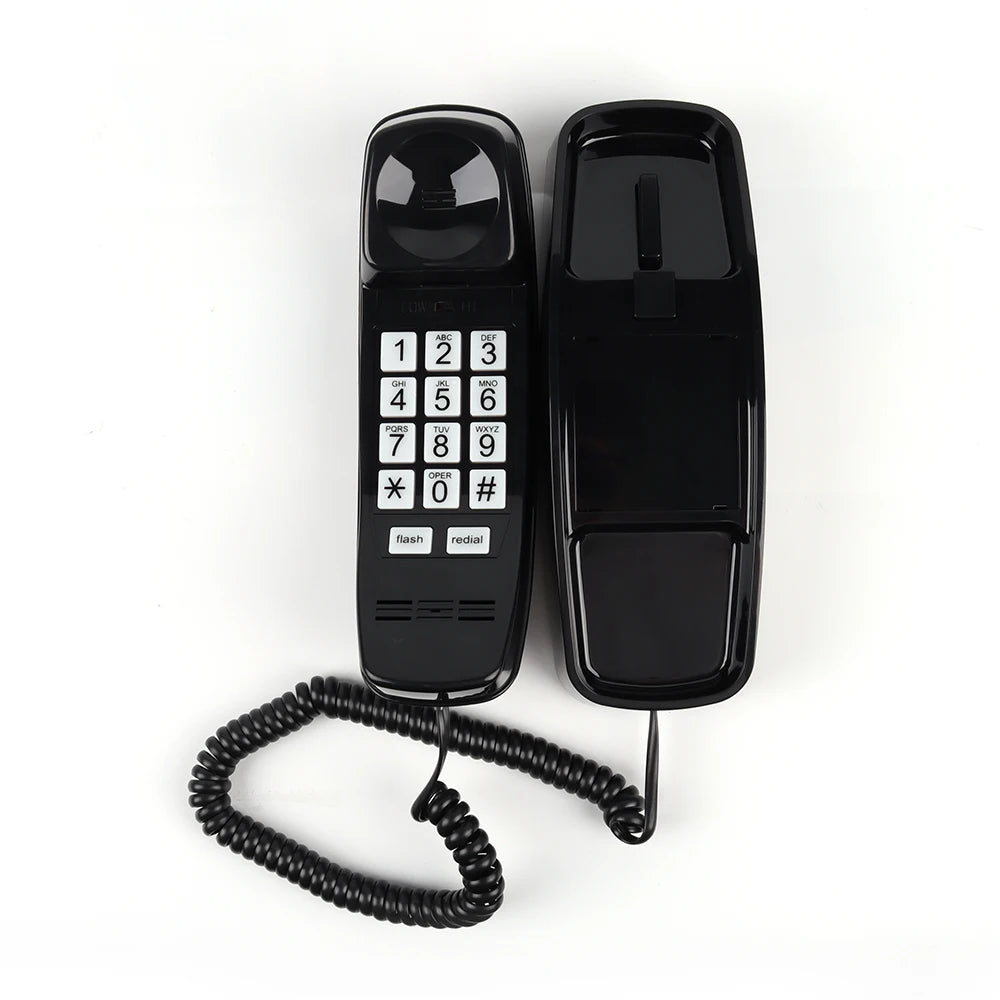 Flat lay of black kawaii retro corded home phone with long cord and classic layout