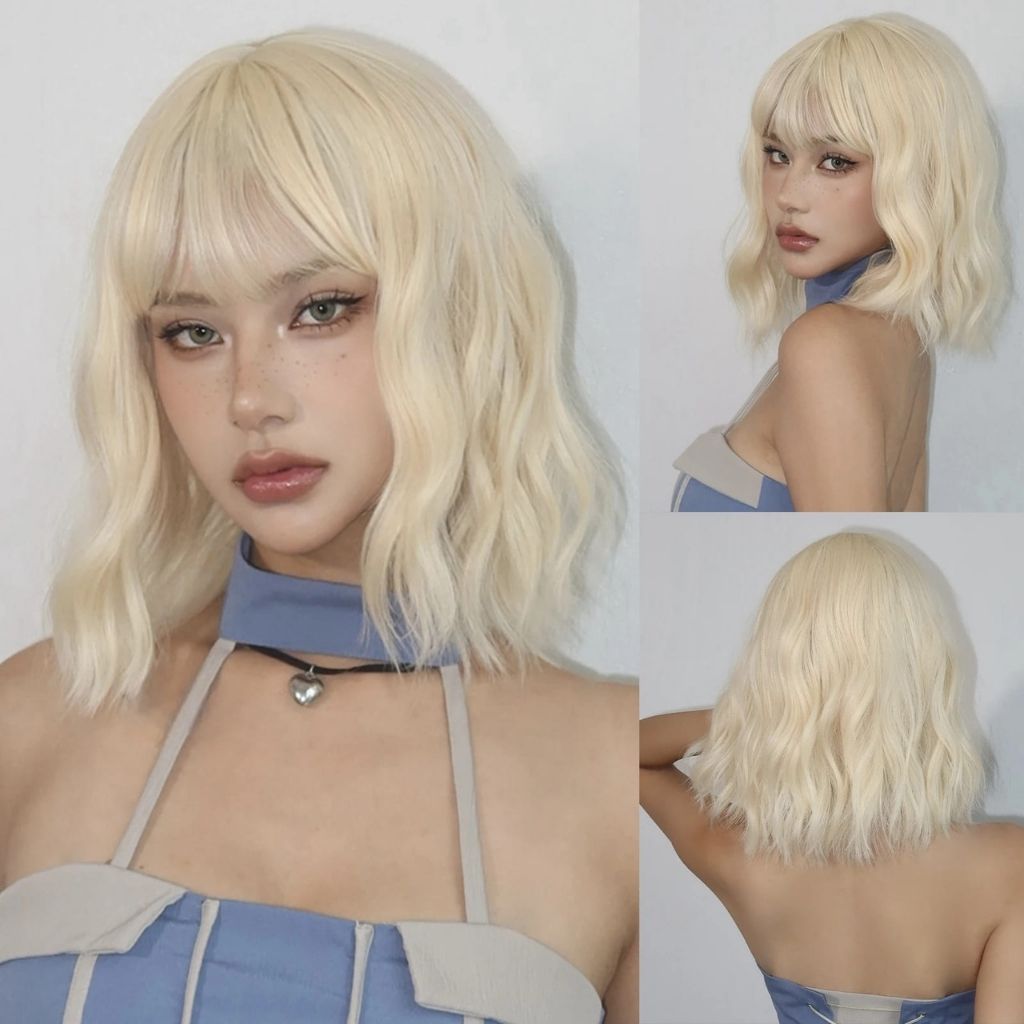 Blonde version of the Little Romantic Wavy Bob Wig with soft curls and full bangs