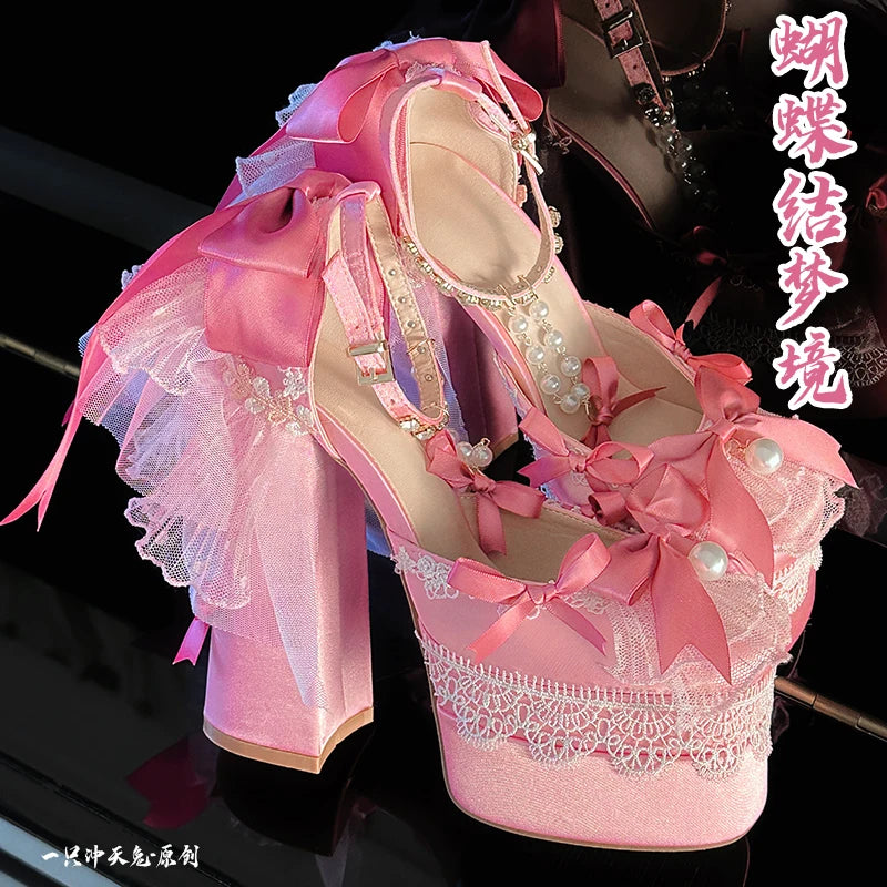 Pastel pink Lolita Bombshell heels with elegant ribbon and pearl accents, kawaii fashion vibe