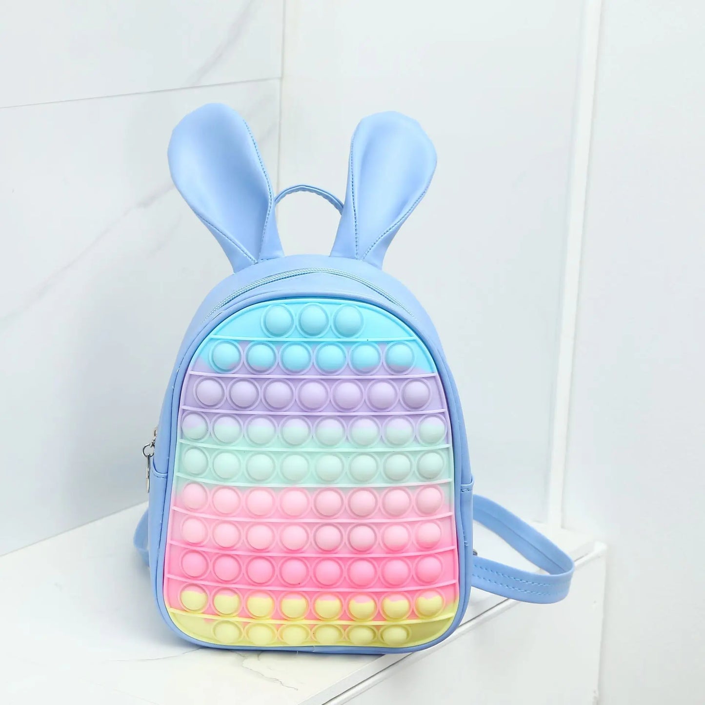 Bubble Pop Bunny Backpack in pastel blue silicone with bubble texture, kawaii ABDL style