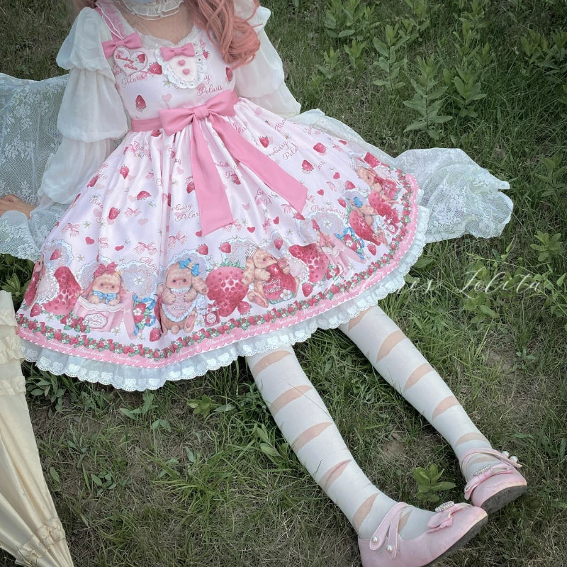 Bunnycore pink lolita dress with flowy ruffles, puff sleeves, and charming strawberry details