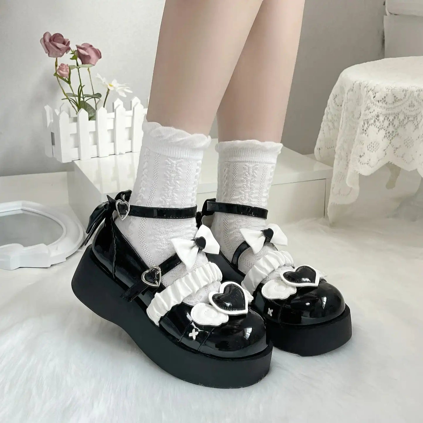 Deep black Cherub Heart Cutie Platforms with ethereal wing details and sweet heart accent for gothic lolita or ABDL style.