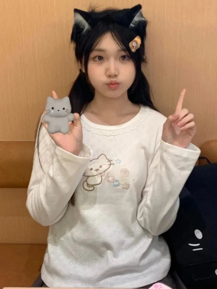 Mint pastel long sleeve tee with playful kitten embroidery and cozy fit for soft girl and ABDL fashion