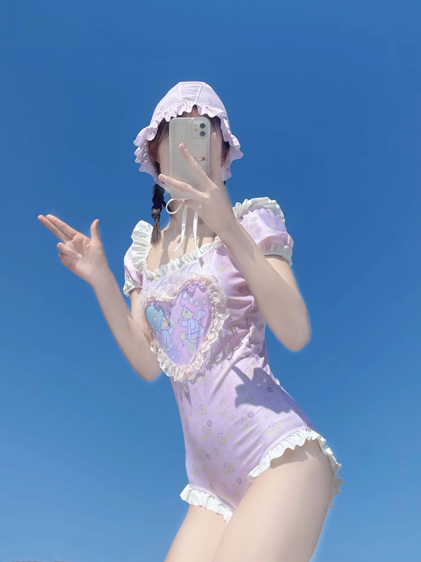 Cuddly pale pink onesie featuring cherub heart and soft ruffle trim for kawaii softcore looks
