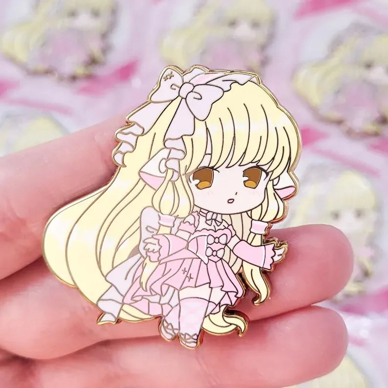 Cute chibi girl Lolita enamel pin with frilly pink outfit and thigh-high socks, perfect kawaii gift