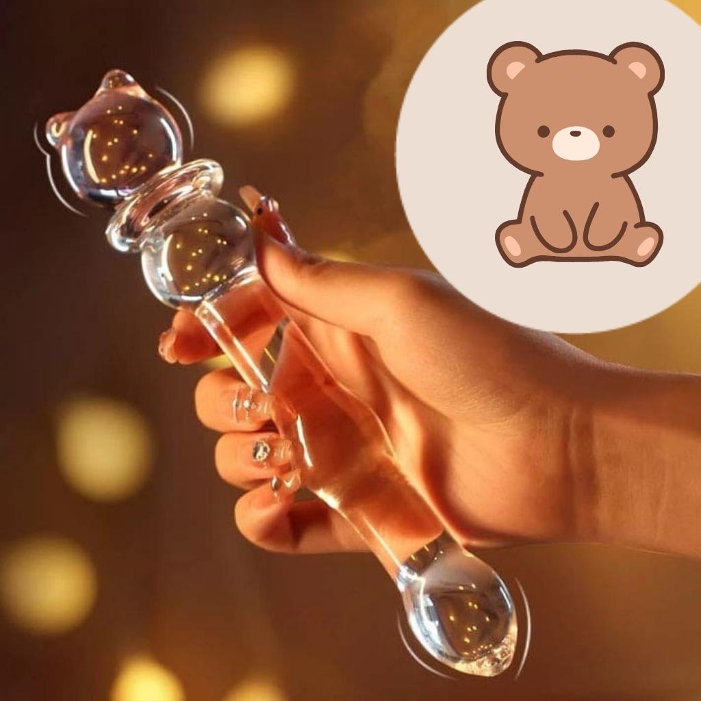 Body-safe glass wand with sparkly beaded shaft and playful bear top for versatile solo or couple use.