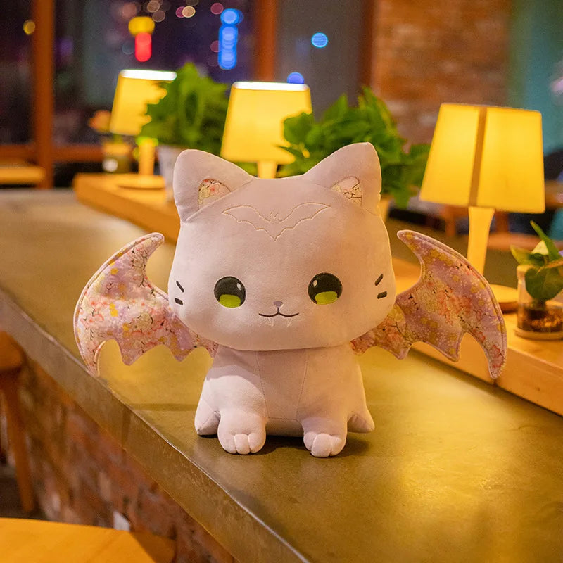 Adorable pastel kitty plush with bat wings, perfect for DDLG play and kawaii décor