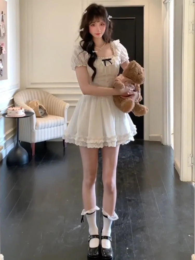Cute white frilly mini dress with black ribbon, kawaii lolita-inspired fashion for DDLG ABDL lovers