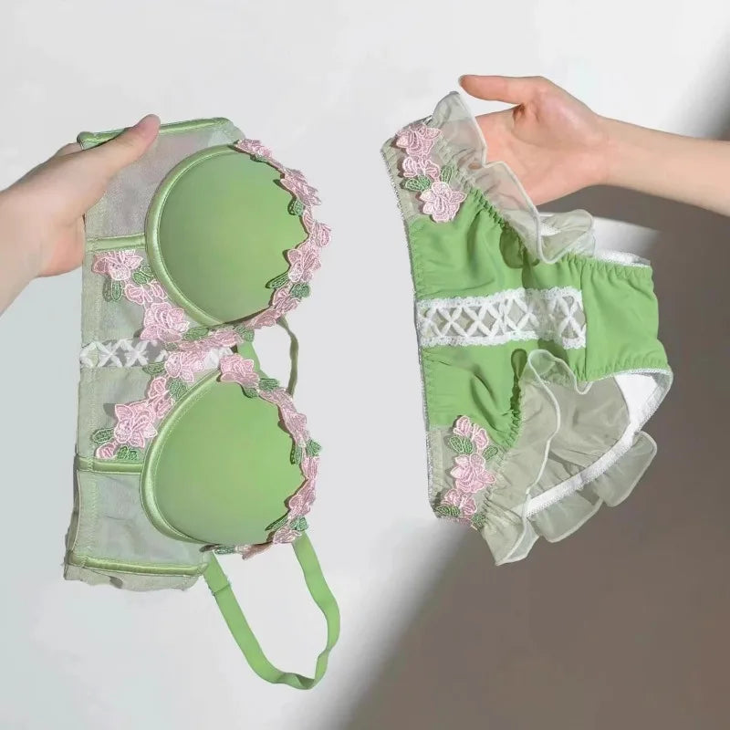 Green garden-inspired bustier and lace-up panty set with embroidered flowers and ruffle details for DDLG ABDL kawaii outfits