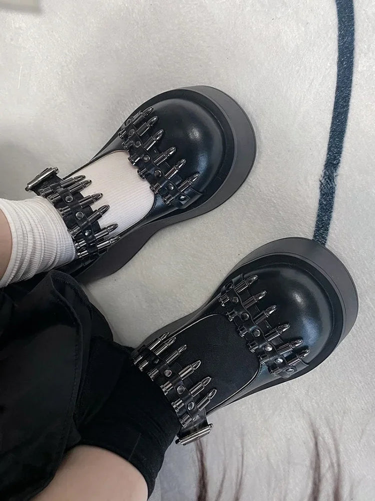 Bold platform shoes with bullet-inspired straps, perfect for DDLG and cutecore fashion outfits