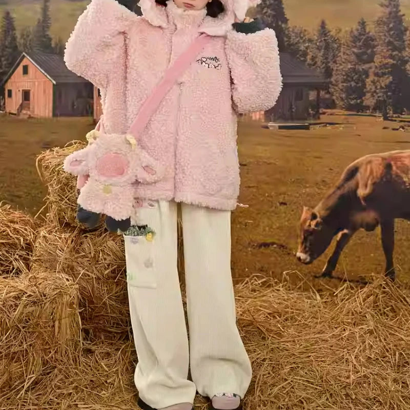 White babycore pocket pants featuring a fluffy sheep patch and soft embroidered meadow details