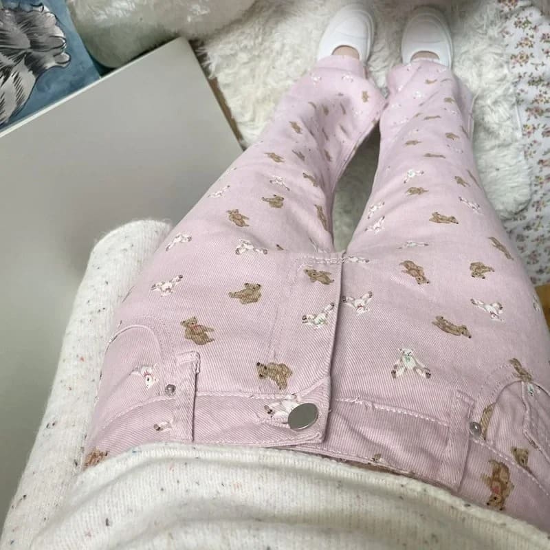 Pink denim pants with tapered dolly legs and plush bear print, ideal for ABDL and kawaii dollcore looks
