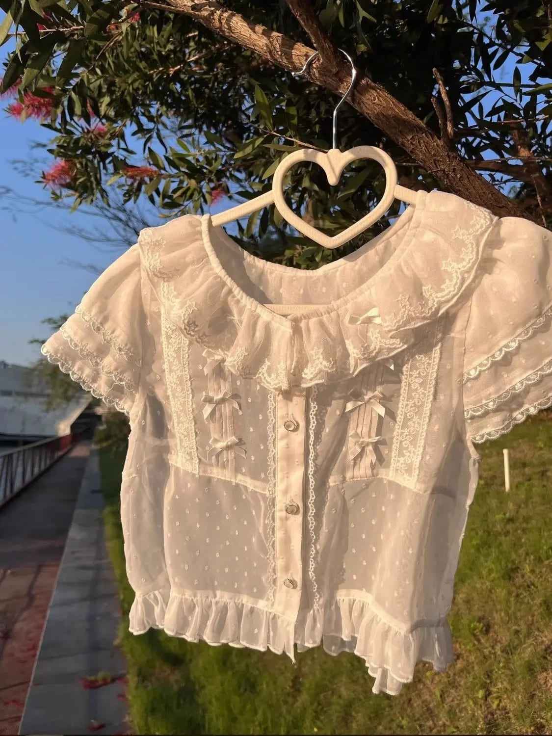 Dreamy white lolita top with fairy-style ruffles and lightweight breathable fabric