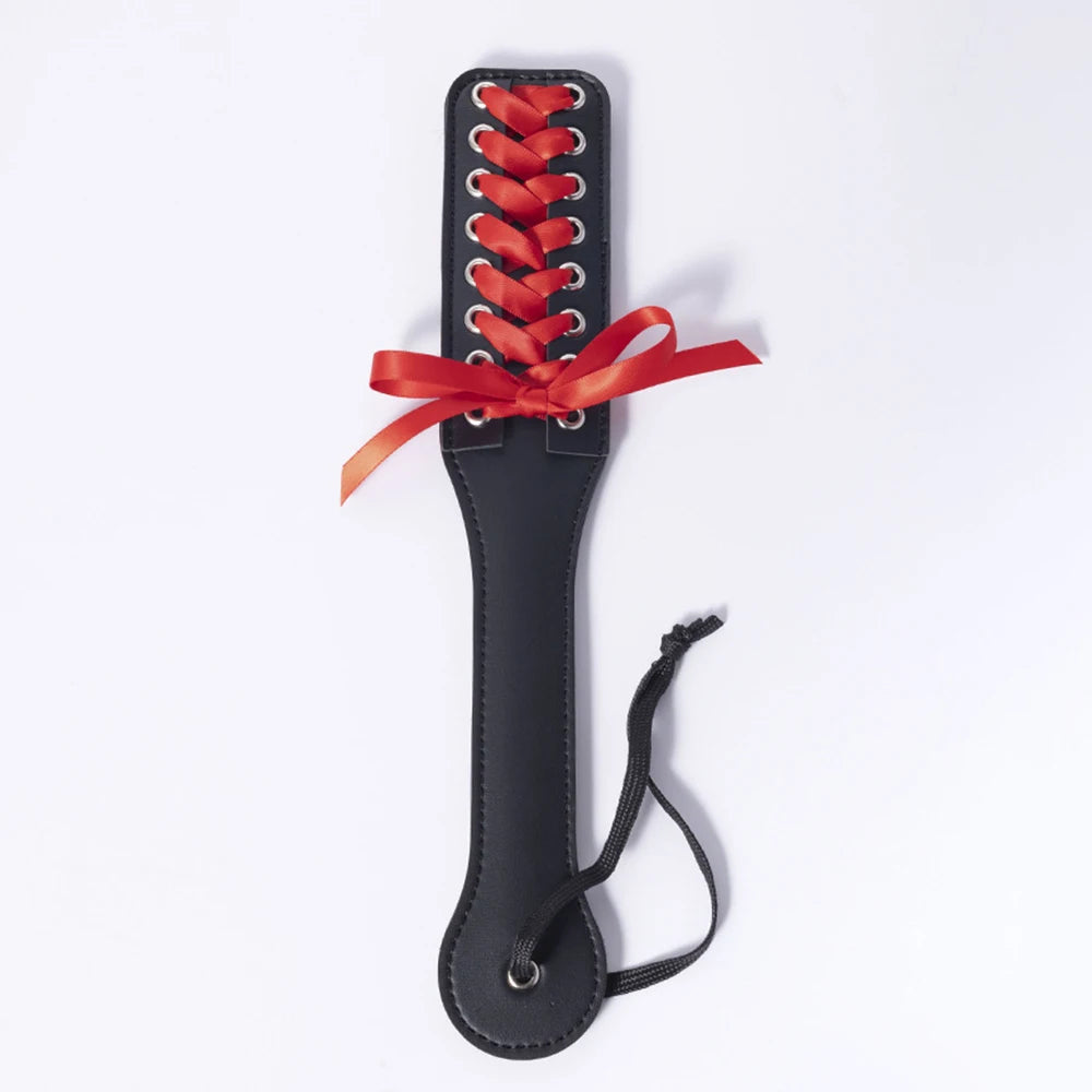 Flirty corset paddle in PU leather, perfect for DDLG, cosplay, and playful spanking