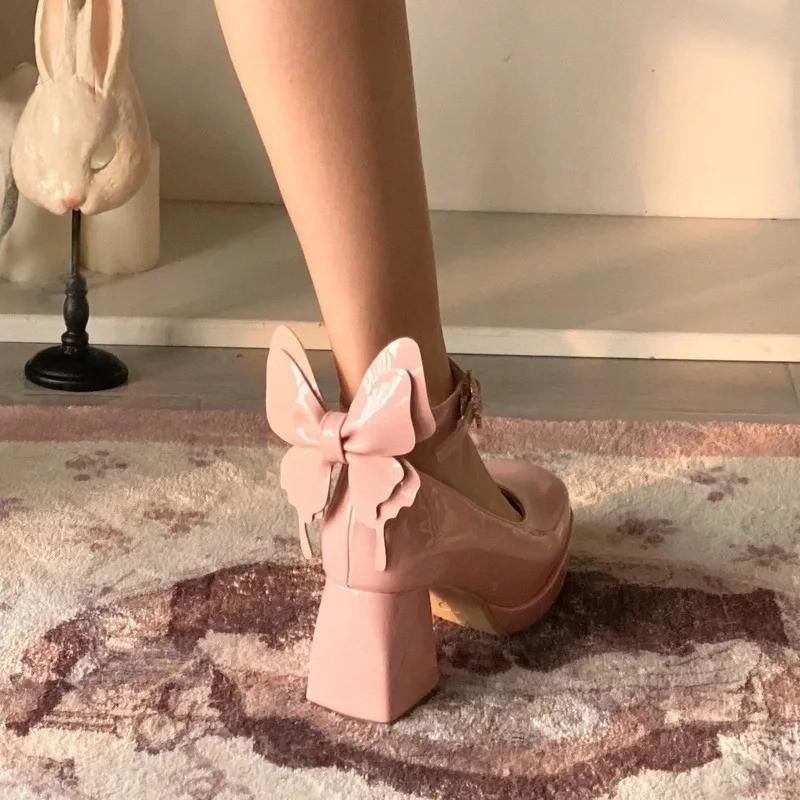 Rose pink Flutterbaby 3D butterfly heels with heart buckles for kawaii baddie, pastel dollcore, and TikTok-ready looks