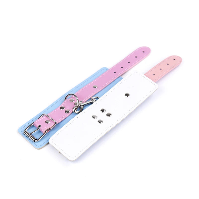Kawaii pastel pink and blue cuffs, soft vegan leather for playful DDLG adventures