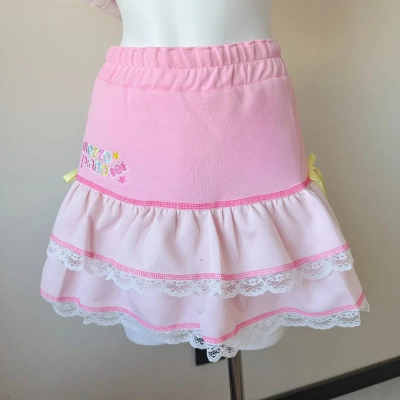 Kawaii bubblegum ruffle skirt featuring double-layer ruffles, lace details, and sweet side bows