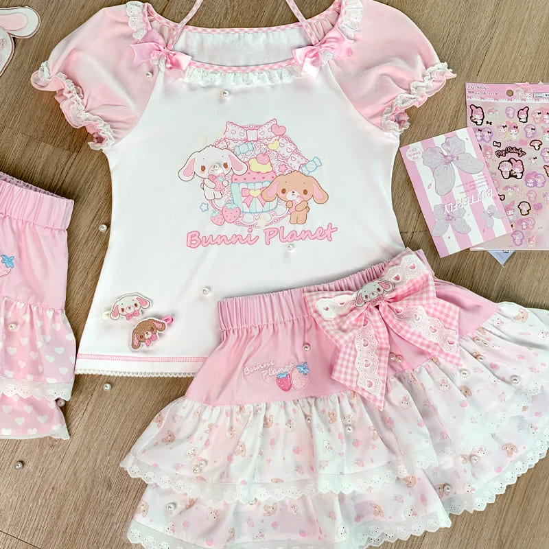 Full kawaii bunny planet outfit laid flat featuring matching pink top and skirt