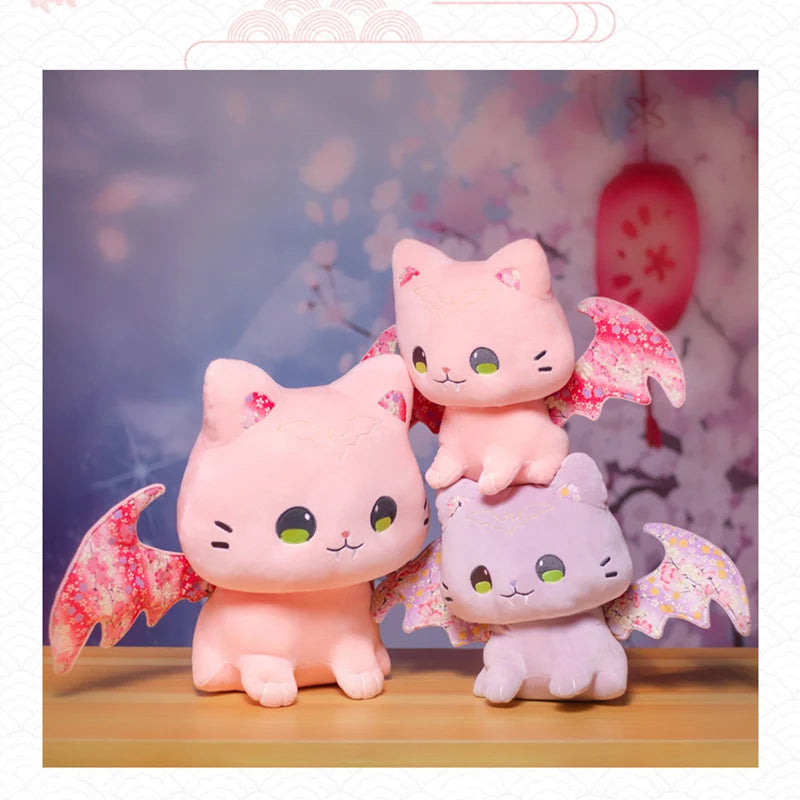 Kawaii flying bat-cat plush in pastel pink and purple, soft and dreamy for snuggles