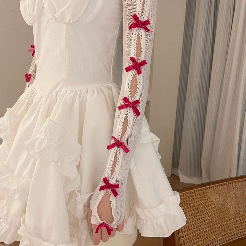 Full-arm lace gloves in hot pink and white, kawaii bolero style with ribbon accents for cosplay, little space, and cutecore aesthetic