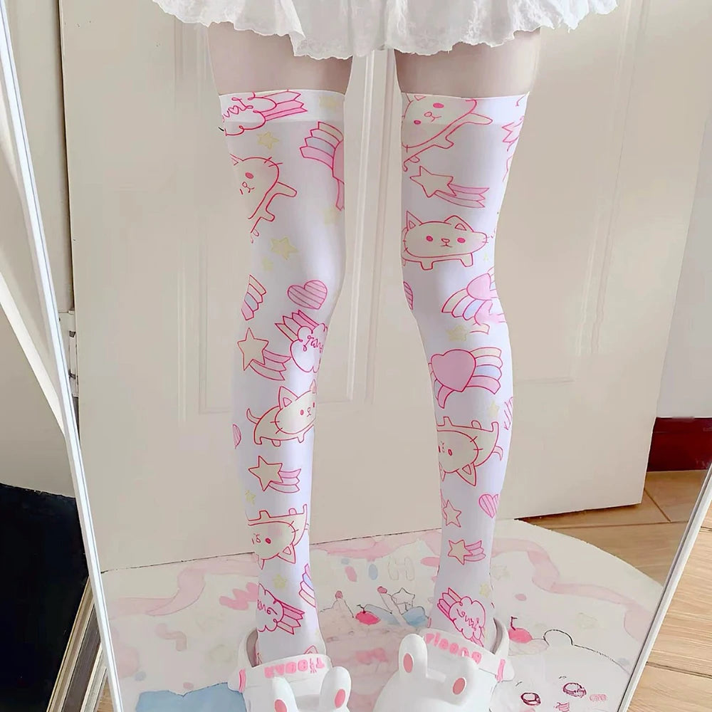 Pink thigh-high stockings featuring magical kitty prints, stretchy and comfy for soft space and bratty vibes.