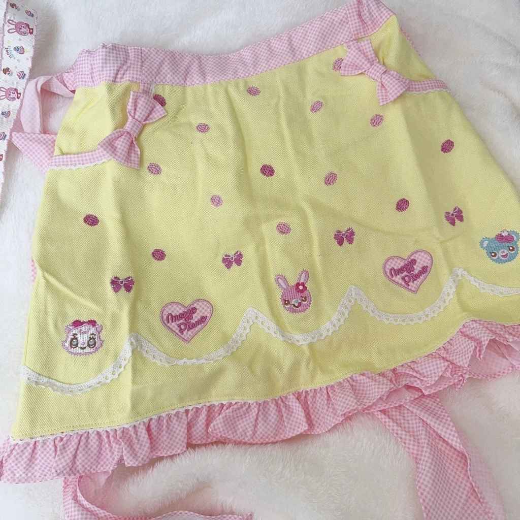 Kawaii pastel skirt with yellow ribbons and animal detail, perfect for Lolita fashion