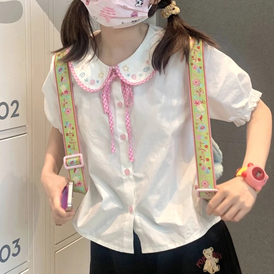 Kawaii preppy blouse with lace collar and plaid pattern, a statement piece for layering or solo styling
