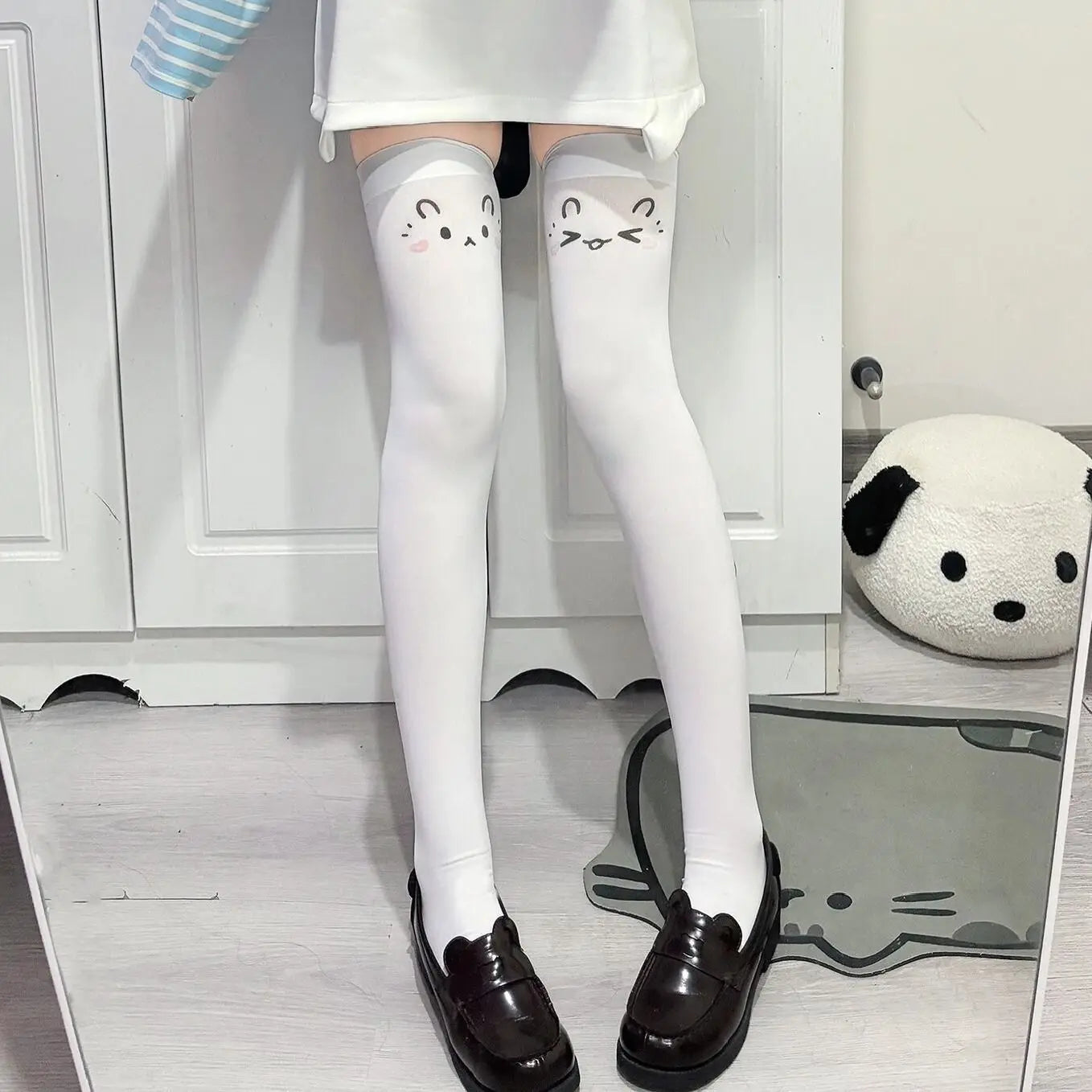 Leg candy stockings with kawaii emoji faces, ideal for cosplay, DDLG, ABDL, and pastel-inspired outfits.