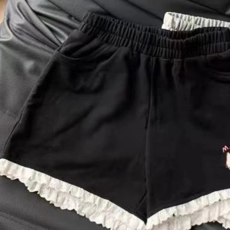 Black lounge shorts with kitten motif and ruffle accents for kawaii DDLG ABDL soft girl outfits