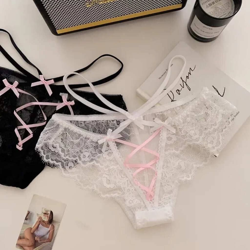 Black and white lace mesh lingerie with sweet bow accents, sheer fabric, and a flirty, romantic design