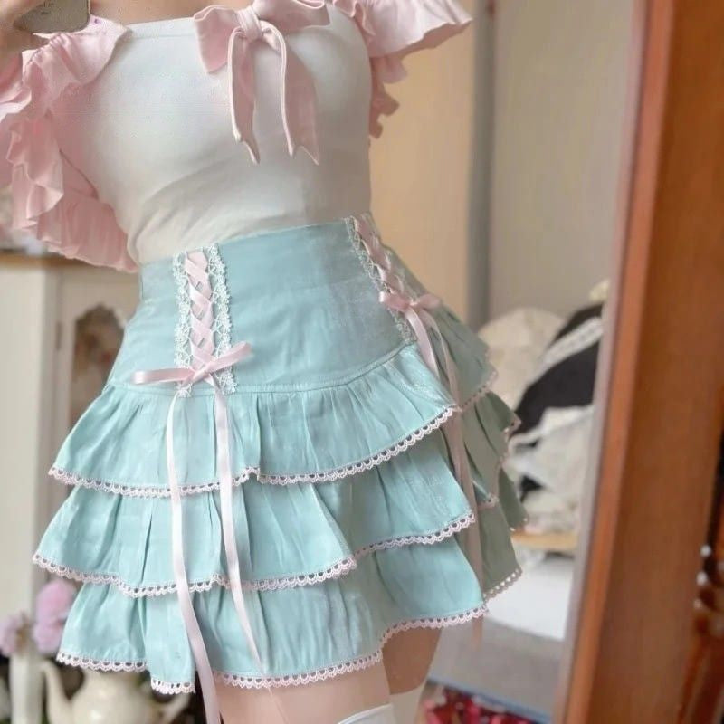 Light blue Fairycore Lolita High Waist Ribbon Skirt with pink ribbon details and soft frilly design