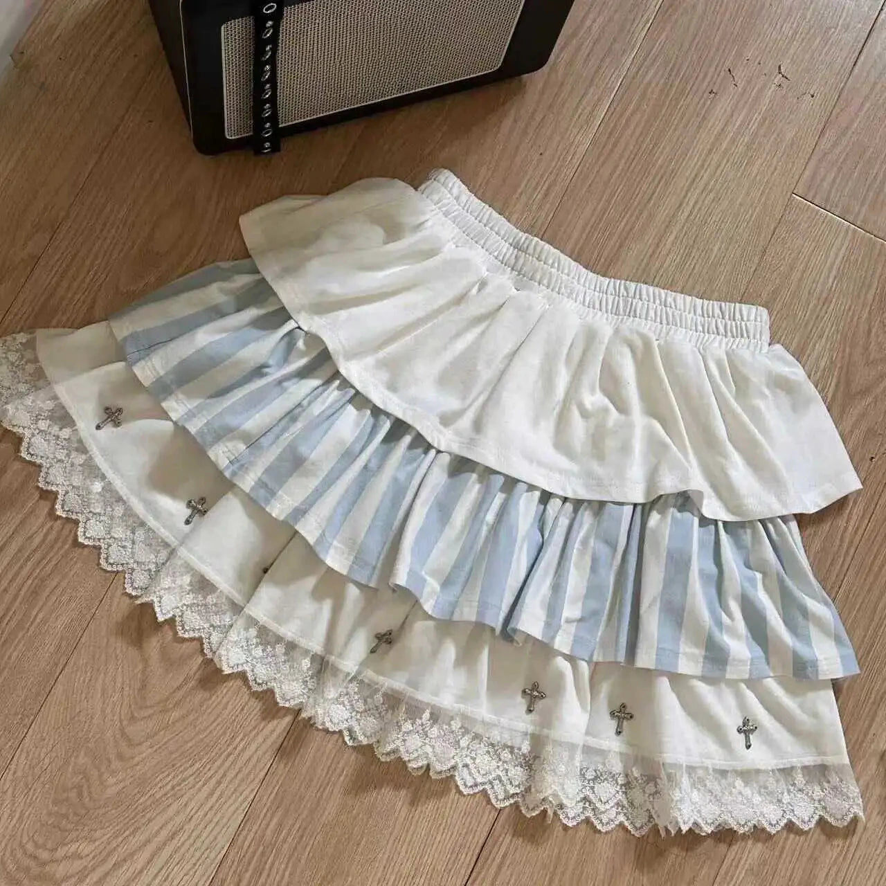 Light blue striped lolita skirt with frilly layers and cross appliqués for DDLG ABDL soft goth and kawaii styles