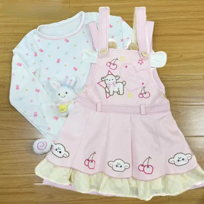 Model lounging in Little Sheep pastel suspender outfit, perfect for cuddly and sweet vibes