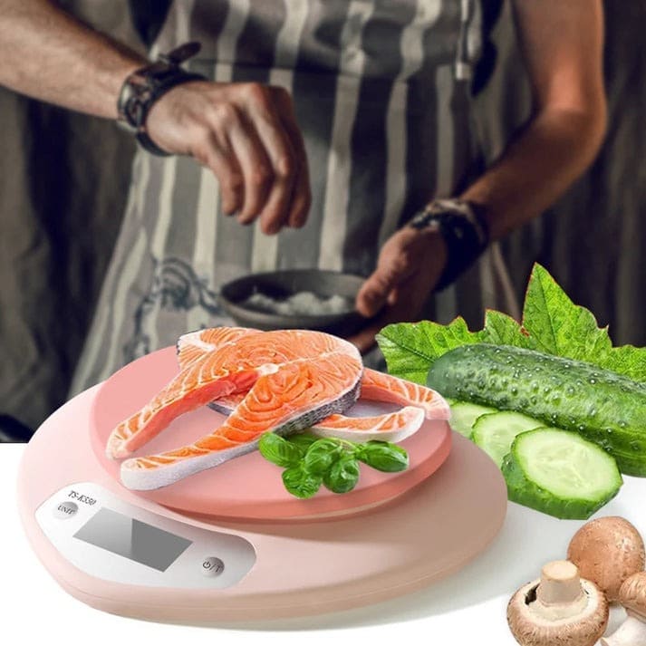 Lightweight pink digital scale with LCD screen and 1g precision for baking, cooking, and portion tracking