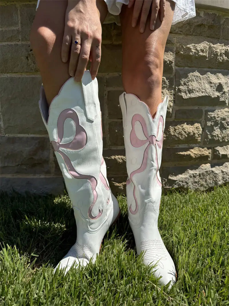 Soft pink princess cowgirl boots with glitter accents and ribbon details, perfect for kawaii and pastelcore aesthetics