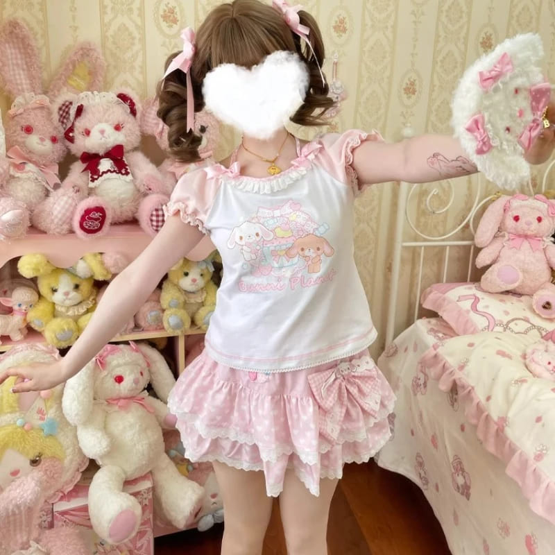 Model wearing kawaii bunny planet set in pastel pink and white with cute bunny print