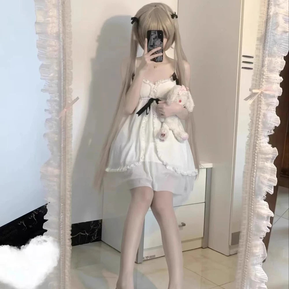 monochrome black and white Lolita nightdress with layered frills and bow accents for whimsical little-space fantasy