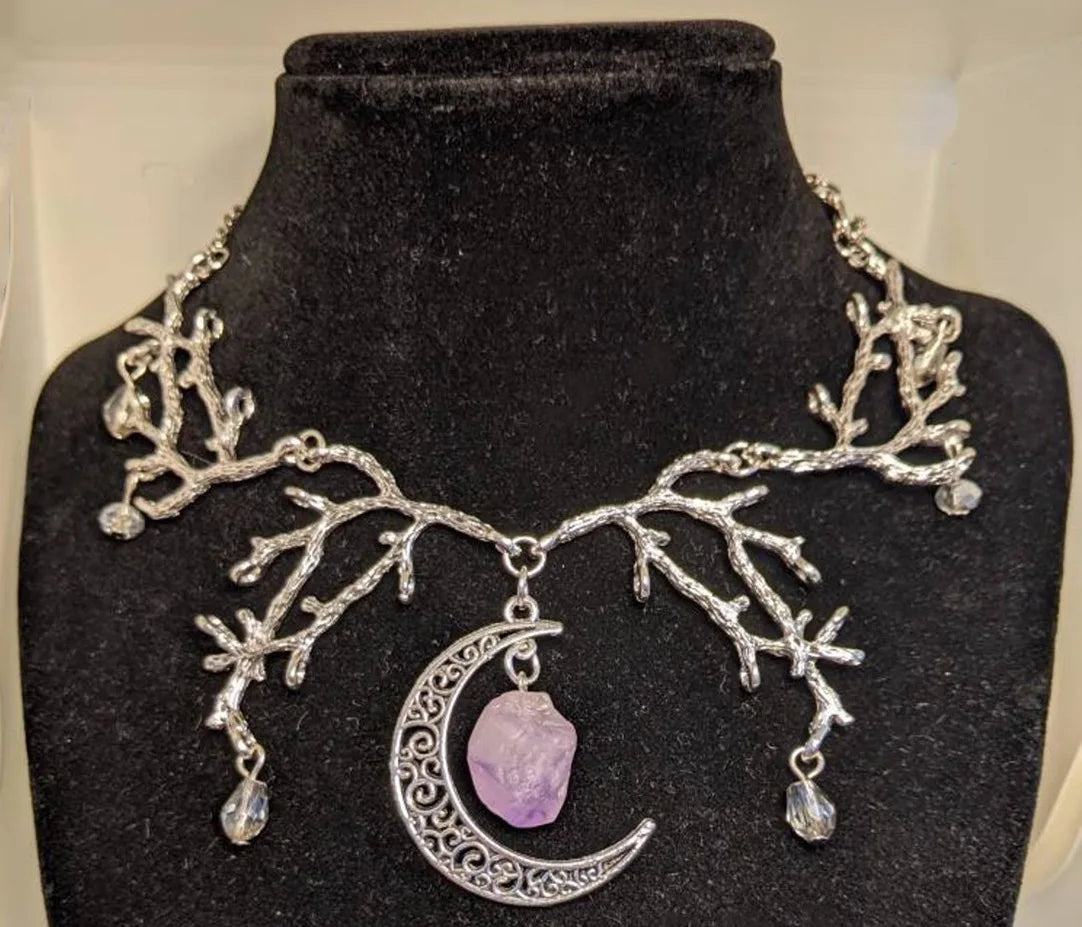 Intricate vine design on Mystic Amethyst Vine Necklace with shimmering crystals and crescent moon charm