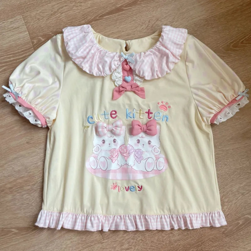 Pastel aesthetic outfit with soft fabric, kitten graphics, and comfy fit