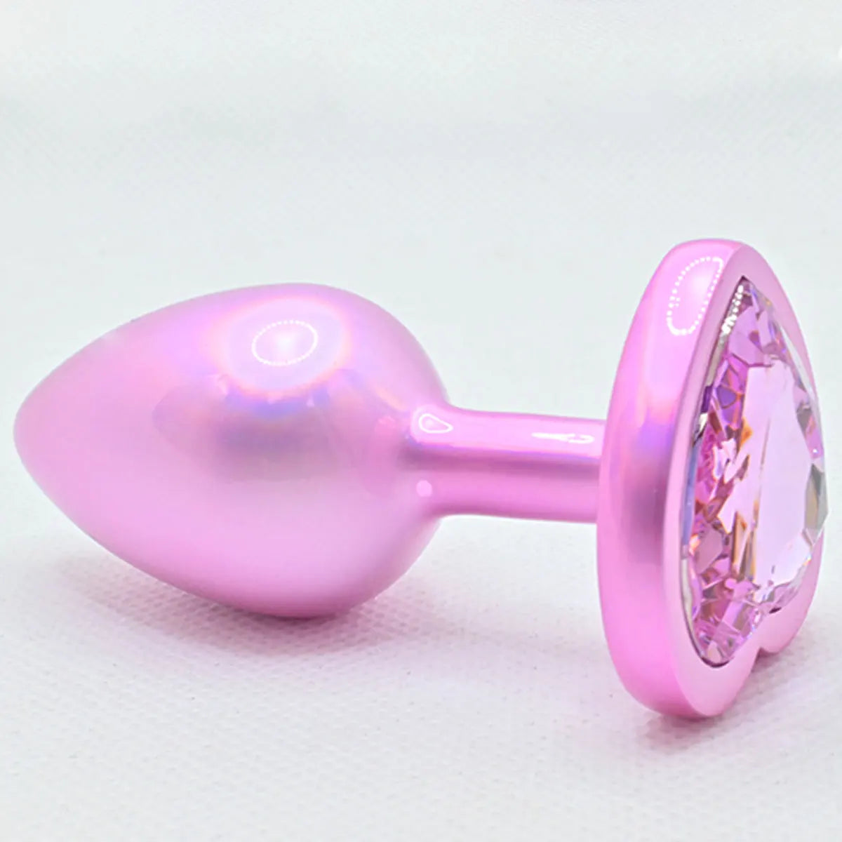 Pastel baddie holographic heart plug with shimmering finish, perfect for kawaii kink play