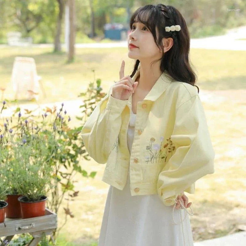 Pastel yellow cropped denim jacket with floral embroidery β kawaii ddlg abdl fashion piece glowing in golden hour