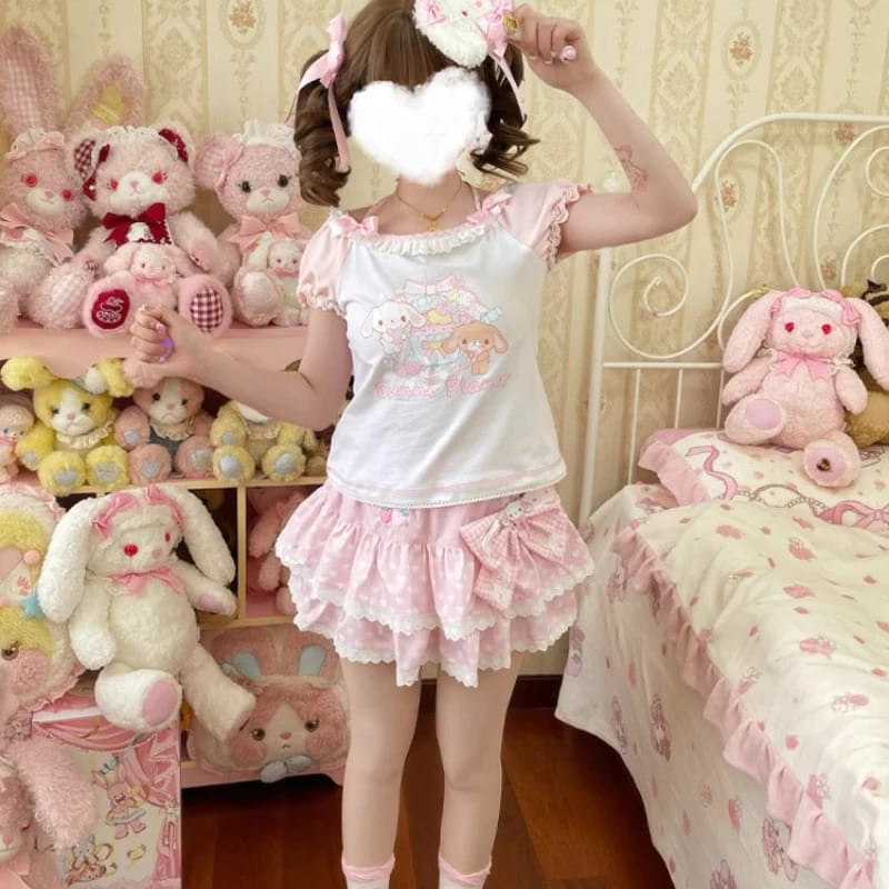 Side view of model in kawaii bunny planet outfit with soft pink and white colors
